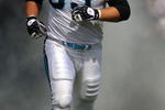 CHARLOTTE, NC - SEPTEMBER 28:  Offensive left tackle Jordan Gross #69 of the Carolina Panthers runs out of the tunnel during introductions before the game against the Atlanta Falcons at Bank of America Stadium on September 28, 2008 in Charlotte, North Carolina. The Carolina Panthers won the game 24-9. (Photo by Steve Dykes/Getty Images)