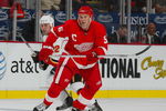 DETROIT-OCTOBER 10:  Niklas Lidstrom #5 of the Detroit Red Wings defends against Daymond Langkow #22 of the Calgary Flames in a game on October 10, 2007 at the Joe Louis Arena in Detroit, Michigan. The Red Wings defeated the Flames 4-2. (Photo by Claus Andersen/Getty Images)
