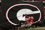 ATHENS, GA - NOVEMBER 29:  Bryan Evans #3 of the Georgia Bulldogs leads the team onto the field during pre-game festivities before the game against the Georgia Tech Yellow Jackets at Sanford Stadium on November 29, 2008 in Athens, Georgia.  The Yellow Jackets defeated the Bulldogs 45-42.  (Photo by Mike Zarrilli/Getty Images)