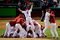 PHILADELPHIA - OCTOBER 29:  Shane Victorino #8 of the Philadelphia Phillies dives on top of his teammates as they pile on top of closing pitcher Brad Lidge #54 after they won 4-3 to win the World Series against the Tampa Bay Rays during the continuation of game five of the 2008 MLB World Series on October 29, 2008 at Citizens Bank Park in Philadelphia, Pennsylvania.  (Photo by Jeff Zelevansky/Getty Images)
