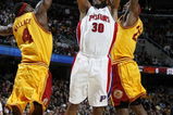 CLEVELAND - FEBRUARY 22:  Rasheed Wallace #30 of the Detroit Pistons gets a shot off between Ben Wallace #4 and LeBron James #23 of the Cleveland Cavaliers on February 22, 2009 at the Quicken Loans Arena in Cleveland, Ohio. Cleveland won the game 99-78. NOTE TO USER: User expressly acknowledges and agrees that, by downloading and or using this photograph, User is consenting to the terms and conditions of the Getty Images License Agreement.  (Photo by Gregory Shamus/Getty Images)