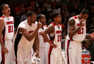 NEW YORK - MARCH 14:  The Louisville Cardinals bench reacts late in the game against the Syracuse Orange during the championship game of the Big East Tournament at Madison Square Garden on March 14, 2009 in New York City.  (Photo by Michael Heiman/Getty Images)