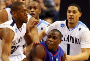PHILADELPHIA - MARCH 19:  Derrick Mercer #3 of the American Eagles looks to pass against Dwayne Anderson #22 and Scottie Reynolds #1 of the Villanova Wildcats during the first round of the NCAA Division I Men's Basketball Tournament at the Wachovia Center on March 19, 2009 in Philadelphia, Pennsylvania.  (Photo by Jim McIsaac/Getty Images)
