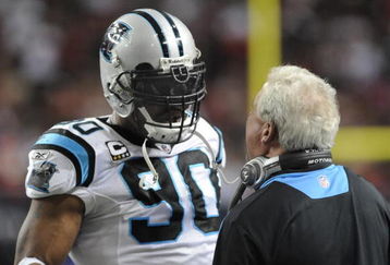 ATLANTA - NOVEMBER 23: Defensive end Julius Peppers talks with coach John Fox of the Carolina Panthers during play against the Atlanta Falcons at the Georgia Dome on November 23, 2008 in Atlanta, Georgia.  (Photo by Al Messerschmidt/Getty Images) 