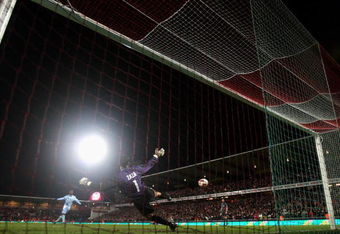 AALBORG, DENMARK - MARCH 19:  Shaun Wright - Phillips of Manchester City scores his penalty during the penalty shootout at the UEFA Cup, Round of 16, Second Leg match between Aalborg and Manchester City on March 19, 2009 in Aalborg, Denmark.  (Photo by Stuart Franklin/Getty Images)