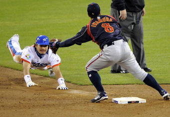 SAN DIEGO - MARCH 19: Taek Keun Lee #29 of Korea slides into second base against Akinori Iwamura #8 of Japan during the 2009 World Baseball Classic Round 2 Pool 1 Game 6 on March 19, 2009 at Petco Park in San Diego, California.  (Photo by Kevork Djansezian/Getty Images)