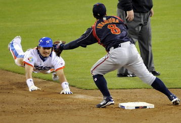 SAN DIEGO - MARCH 19: Taek Keun Lee #29 of Korea slides into second base against Akinori Iwamura #8 of Japan during the 2009 World Baseball Classic Round 2 Pool 1 Game 6 on March 19, 2009 at Petco Park in San Diego, California.  (Photo by Kevork Djansezian/Getty Images)