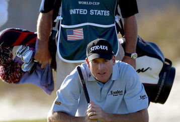 KIAWAH ISLAND, SC - NOVEMBER 13:   im Furyk of the United States lines up a putt as his caddie 'Fluff' Cowan stands behind on the 15th hole during the first round of the World Golf Championships World Cup on November 13, 2003 at the Kiawah Island Golf Resort Ocean Course on Kiawah Island, South Carolina. (Photo by Jamie Squire/Getty Images). 
