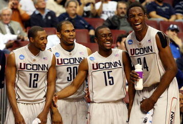 PHILADELPHIA - MARCH 19:  (L-R) A.J. Price #12, Scottie Haralson #30, Kemba Walker #15 and Hasheem Thabeet #34 of the Connecticut Huskies share a laugh from the bench during the game against the Chattanooga Mocs during the first round of the NCAA Division I Men's Basketball Tournament at the Wachovia Center on March 19, 2009 in Philadelphia, Pennsylvania.  (Photo by Jim McIsaac/Getty Images)