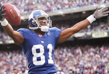 EAST RUTHERFORD, NJ - NOVEMBER 13:  Amani Toomer #81 of the New York Giants scores a touchdown against the Minnesota Vikings during their game at Giants Stadium on November 13, 2005 in East Ruhterford, New Jersey.  (Photo by Al Bello/Getty Images)