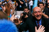 CHAPEL HILL, NC - FEBRUARY 06:  ESPN sports commentator Dick Vitale walks cheers with the North Carolina fans before the Tar Heels host the Duke Blue Devils at the Dean E. Smith Center on February 6, 2008 in Chapel Hill, North Carolina.  This is the first game back for Vitale after having throat surgery.  (Photo by Kevin C. Cox/Getty Images)