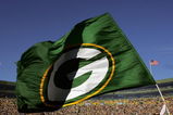 GREEN BAY, WI - OCTOBER 29:  A Green Bay Packers flag is waved during a game against the Arizona Cardinals at Lambeau Field on October 29, 2006 in Green Bay Wisconsin.  The Packers won 31-14.  (Photo by Stephen Dunn/Getty Images)