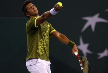 INDIAN WELLS, CA - MARCH 19:  Fernando Verdasco of Spain tosses the ball up before serving to Roger Federer during the BNP Paribas Open at the Indian Wells Tennis Garden on March 19, 2009 in Indian Wells, California.  (Photo by Jeff Gross/Getty Images)