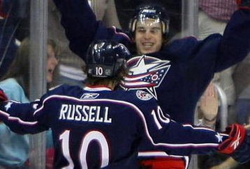 COLUMBUS, OH - MARCH 18: Kris Russell #10 of the Columbus Blue Jackets greets teammate Antoine Vermette #50 who scored in overtime to defeat the Chicago Blackhawks 4-3 at the Nationwide Arena March 18, 2009 in Columbus, Ohio. (Photo by Bruce Bennett/Getty Images)
