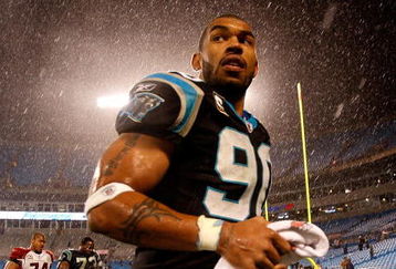 CHARLOTTE, NC - JANUARY 10:  Julius Peppers #89 of the Carolina Panthers walks off the field in the rain after being defeated by the Arizona Cardinals 33-13 in the NFC Divisional Playoff Game on January 10, 2009 at Bank of America Stadium in Charlotte, North Carolina.  (Photo by Streeter Lecka/Getty Images)
