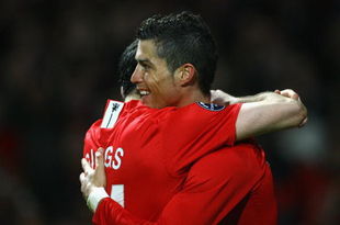MANCHESTER, UNITED KINGDOM - MARCH 11:  Cristiano Ronaldo of Manchester United is congratulated by team mate Ryan Giggs after scoring his team's second goal during the UEFA Champions League Round of Sixteen, Second Leg match between Manchester United and Inter Milan at Old Trafford on March 11, 2009 in Manchester, England.  (Photo by Alex Livesey/Getty Images)