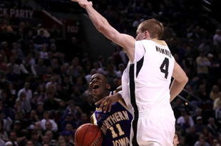 PORTLAND, OR - MARCH 19:  Kwadzo Ahelegbe #11 of the Northern Iowa Panthers goes up for a shot against Robbie Hummel #4 of the Purdue Boilermakers in the second half during the first round of the NCAA Division I Men's Basketball Tournament at the Rose Garden on March 19, 2009 in Portland, Oregon.  (Photo by Jonathan Ferrey/Getty Images)