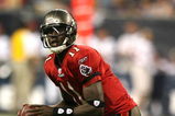HOUSTON - AUGUST 28:  Quarterback  Josh Johnson #11 of the Tampa Bay Buccaneers rolls out looking down-field for a receiver against the Houston Texans Aug. 28, 2008 at Reliant Stadium in Houston, Texas.  (Photo by Bob Levey/Getty Images)
