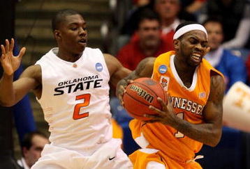DAYTON, OH - MARCH 20: Tyler Smith #1 of the Tennessee Volunteers fights for the ball against Obi Muonelo #2 of the Oklahoma State Cowboys during the first round of the NCAA Division I Men's Basketball Tournament at the University of Dayton Arena on March 20, 2009 in Dayton, Ohio.  (Photo by Andy Lyons/Getty Images)