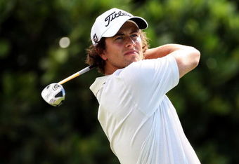 KAPALUA, HI - JANUARY 08:  Adam Scott of Australia plays a shot during the first round of the Mercedes-Benz Championship at the Plantation Course on January 8, 2009 in Kapalua, Maui, Hawaii.  (Photo by Sam Greenwood/Getty Images)
