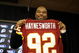 ASHBURN, VA - FEBRUARY 27:  Albert Haynesworth posese with his new jersey at a press conference after signing a 7-year contract worth approximately $100 million with the Washington Redskins on February 27, 2009 at Redskins Park in Ashburn, Virginia.  (Photo by Mitchell Layton/Getty Images)