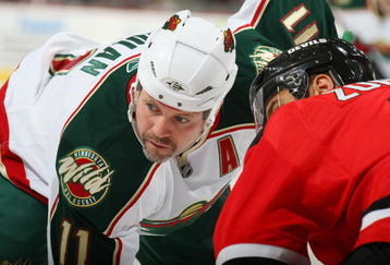 NEWARK, NJ - MARCH 20: Owen Nolan #11 of the Minnesota Wild takes the faceoff against the New Jersey Devils on March 20, 2009 at the Prudential Center in Newark, New Jersey. (Photo by Bruce Bennett/Getty Images)