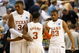 GREENSBORO, NC - MARCH 19:  Dexter Pittman #34, A.J. Abrams #3 and Harrison Smith #23 of the Texas Longhorns celebrate their 76-62 win over the Minnesota Golden Gophers in the final minutes of their first round of the NCAA Division I Men's Basketball Tournament at the Greensboro Coliseum on March 19, 2009 in Greensboro, North Carolina.  (Photo by Streeter Lecka/Getty Images)