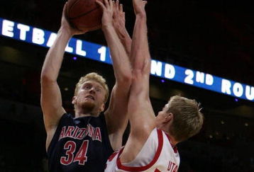 MIAMI - MARCH 20:  Forward Chase Budinger #34 (L) of the University of Arizona Wildcats takes a shot over  center Luke Nevill #50  (R) of the University of Utah Runnin' Utes  during the first round of the NCAA Division I Men's Basketball Tournament at the American Airlines Arena on March 20, 2009 in Miami, Florida.  (Photo by Marc Serota/Getty Images);  (Photo by Marc Serota/Getty Images)