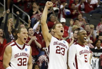 KANSAS CITY, MO - MARCH 19: Taylor Griffin #32, Blake Griffin #23 and Tony Crocker #5 of the Oklahoma Sooners celebrate from their bench area en route to an 82-54 victory over the Morgan State Golden Bears in the second half during the first round of the NCAA Division I Men's Basketball Tournament at the Sprint Center on March 19, 2009 in Kansas City, Missouri.  (Photo by Jamie Squire/Getty Images)