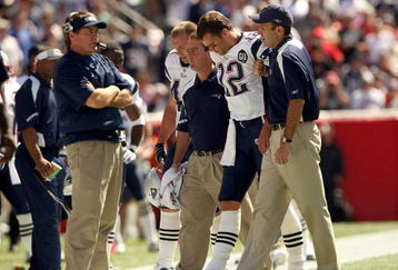 FOXBORO, MA - SEPTEMBER 7:  Quarterback Tom Brady #12 of the New England Patriots walks off the field with the aid of the Patriots staff after being injured on a play during their NFL game against the Kansas City Chiefs on September 7, 2008 at Gillette Stadium in Foxboro, Massachusetts. The Patriots defeated the Chiefs 17-10. (Photo by Elsa Garrison/Getty Images)