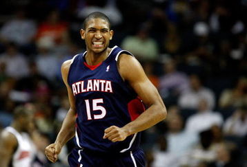 CHARLOTTE, NC - MARCH 06:  Al Horford #15 of the Atlanta Hawks reacts as he runs down the court against the Charlotte Bobcats during their game at Time Warner Cable Arena on March 6, 2009 in Charlotte, North Carolina. NOTE TO USER: User expressly acknowledges and agrees that, by downloading and/or using this Photograph, user is consenting to the terms and conditions of the Getty Images License Agreement.  (Photo by Streeter Lecka/Getty Images)