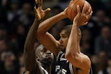 BOSTON - FEBRUARY 08:   Kevin Garnett #5 of the Boston Celtics puts the pressure on Tim Duncan #21 of the San Antonio Spurs on February 8, 2009 at TD Banknorth Garden in Boston, Massachusetts. The Spurs defeated the Celtics 105-99. NOTE TO USER: User expressly acknowledges and agrees that, by downloading and or using this Photograph, user is consenting to the terms and conditions of the Getty Images License Agreement.  (Photo by Elsa/Getty Images)