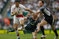 LONDON - MARCH 21: Chris Paterson of Scotland (R) and Simon Taylor of Scotland tackle Riki Flutey of England during the RBS 6 Nations Championship match between England and Scotland at Twickenham on March 21, 2009 in London, England. (Photo by Paul Gilham/Getty Images)