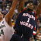 MINNEAPOLIS - MARCH 20:  Rob Robinson #1 of the Robert Morris Colonials drives for a shot attempt against Goran Suton #14 of the Michigan State Spartans during the first round of the NCAA Division I Men's Basketball Tournament at the Hubert H. Humphrey Metrodome on March 20, 2009 in Minneapolis, Minnesota.  (Photo by Jonathan Daniel/Getty Images)