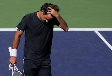 INDIAN WELLS, CA - MARCH 21:  Roger Federer of Switzerland walks to the net after losing his semifinal match to Andy Murray of Great Britain in the BNP Paribas Open on March 21, 2009 at the Indian Wells Tennis Garden in Indian Wells, California.  (Photo by Matthew Stockman/Getty Images)