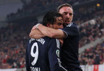 MUNICH, GERMANY - JANUARY 26:  Franck Ribery of Bayern Munich (R) and his team mate Luca Toni (L) jubilate during the round of 16 DFB Cup match between VfB Stuttgart and FC Bayern Muenchen at the Mercedes-Benz Arena on January 27, 2009 in Stuttgart, Germany.  (Photo by Miguel Villagran/Getty Images)