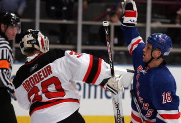 NEW YORK - APRIL 13: Sean Avery #16 of the New York Rangers tries to screen Martin Brodeur #30 of the New Jersey Devils during game three of the 2008 NHL Eastern Conference Quarterfinals on April 13, 2008 at Madison Square Garden in New York City.  (Photo by Jim McIsaac/Getty Images)