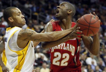KANSAS CITY, MO - MARCH 19:  Jerome Randle #2 of the California Golden Bears gets a hand on the ball as Adrian Bowie #22 of the Maryland Terrapins makes a move to the basket in the second half during the first round of the NCAA Division I Men's Basketball Tournament at the Sprint Center on March 19, 2009 in Kansas City, Missouri.  (Photo by Jamie Squire/Getty Images)