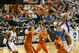 GREENSBORO, NC - MARCH 21:  Gerald Henderson #15 of the Duke Blue Devils lays in a basket against A.J. Abrams #3 and Clint Chapman #53 of the Texas Longhorns during the second round of the NCAA Division I Men's Basketball Tournament at the Greensboro Coliseum on March 21, 2009 in Greensboro, North Carolina.  (Photo by Streeter Lecka/Getty Images)