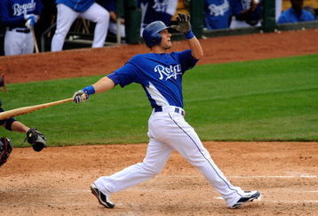 SURPRISE, AZ - MARCH 03:  Alex Gordon #4 of the Kansas City Royals follows through on a grand slam home run against Cleveland Indians during the fifth inning of a spring training game at the Surprise Stadium on March 3, 2009 in Surprise, Arizona.  (Photo by Kevork Djansezian/Getty Images)