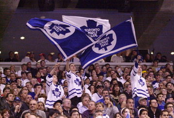 7 May 2001: Toronto Maple Leafs fans waves flags during game 6 of the Eastern Conference Semifinals against the New Jersey Devils at the Air Canada Center in Toronto, Ontario, Canada.  The Devils won 4-2. DIGITAL IMAGE.  Mandatory Credit: Harry How/ALLSPORT