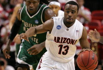 MIAMI - MARCH 22:  Guard Nic Wise #13 of the  University of Arizona Wildcats steals the ball from forward J'Nathan Bullock (L) of the Cleveland State University Vikings during the second round of the NCAA Division I Men's Basketball Tournament at the American Airlines Arena on March 22, 2009 in Miami, Florida.  (Photo by Marc Serota/Getty Images)