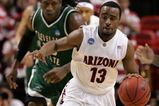 MIAMI - MARCH 22:  Guard Nic Wise #13 of the  University of Arizona Wildcats steals the ball from forward J'Nathan Bullock (L) of the Cleveland State University Vikings during the second round of the NCAA Division I Men's Basketball Tournament at the American Airlines Arena on March 22, 2009 in Miami, Florida.  (Photo by Marc Serota/Getty Images)
