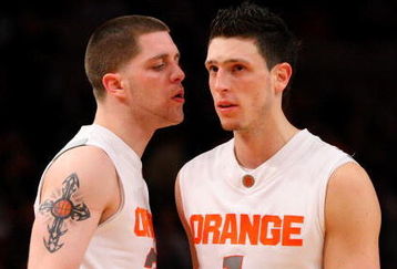 NEW YORK - MARCH 13: Eric Devendorf #23 and Andy Rautins #1 of the Syracuse Orange react late in the game against the West Virginia Mountaineers during the semifinal round of the Big East Tournament at Madison Square Garden on March 13, 2009 in New York City.  (Photo by Jim McIsaac/Getty Images)
