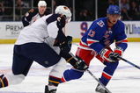 NEW YORK - FEBRUARY 3:  Nikolai Zherdev #13 of the New York Rangers skates with the puck against Ron Hainsey #6 of the Atlanta Thrashers during the game on February 3, 2009 at Madison Square Garden in New York City.  (Photo by Chris McGrath/Getty Images)