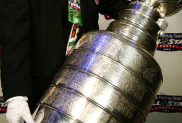 MONTREAL- JANUARY 23:  Steve Poirier of the Hockey Hall of Fame arrives with the Stanley Cup at The Hockey News / NHL All-Star party at Gare Dalhousie as part of the 2009 NHL All-Star Weekend on January 23, 2009 in Montreal, Quebec. (Photo by Phillip MacCallum/Getty Images)