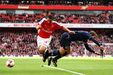 LONDON - MARCH 14:  Theo Walcott of Arsenal is challenged by Stephen Warnock of Blackburn Rovers during the Barclays Premier League match between Arsenal and Blackburn Rovers at Emirates Stadium on March 14, 2009 in London, England.  (Photo by Clive Mason/Getty Images)