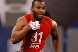 INDIANAPOLIS, IN - FEBRUARY 22:  Running back Beanie Wells of Ohio State runs with the football during the NFL Scouting Combine presented by Under Armour at Lucas Oil Stadium on February 22, 2009 in Indianapolis, Indiana. (Photo by Scott Boehm/Getty Images)
