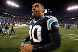 CHARLOTTE, NC - DECEMBER 08:  Julius Peppers #90 of the Carolina Panthers walks off the field after a victory over the Tampa Bay Buccaneers at Bank of America Stadium on December 8, 2008 in Charlotte, North Carolina.  (Photo by Streeter Lecka/Getty Images)