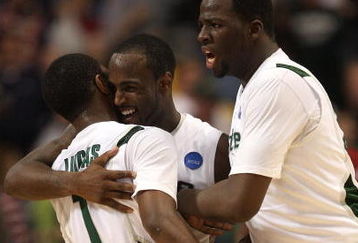 MINNEAPOLIS - MARCH 22:  (L-R) Kalin Lucas #1, Travis Walton #5 and Draymond Green #23 of the Michigan State Spartans celebrate after their 74-69 win against the USC Trojans during the second round of the NCAA Division I Men's Basketball Tournament at the Hubert H. Humphrey Metrodome on March 22, 2009 in Minneapolis, Minnesota.  (Photo by Jonathan Daniel/Getty Images)